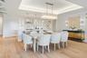 Dining area with tongue and groove ceiling details and lighting
