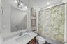 Full bath with tub/shower combination and updated vanity area.