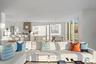 Living room with light hardwood / wood-style floors and an inviting chandelier