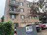 View of apartment building / complex with driveway