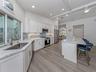 Solid wood cabinetry, soft close drawers, newer appliances makes entertaining in this kitchen a breeze