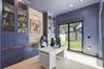 Office / 6th bedroom with custom cabinetry, and direct access outdoor areas