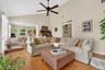 Living area featuring high vaulted ceiling, a ceiling fan, wood finished floors, and recessed lighting