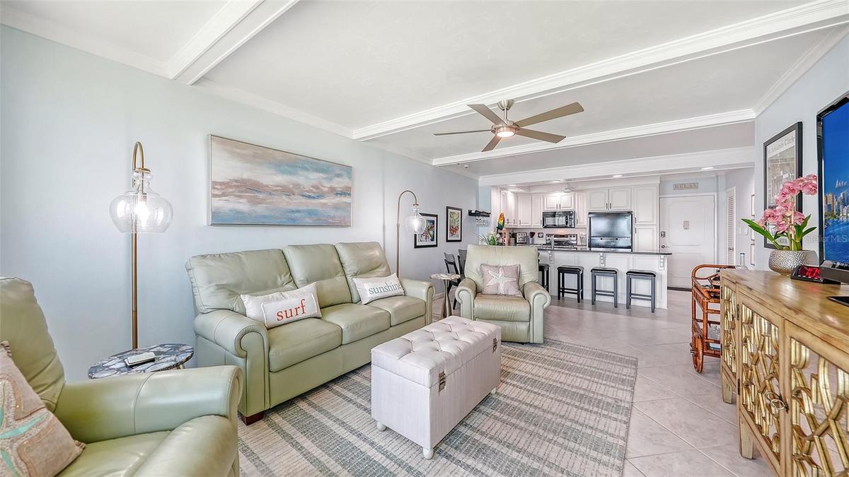 The open concept living, dining and kitchen shown