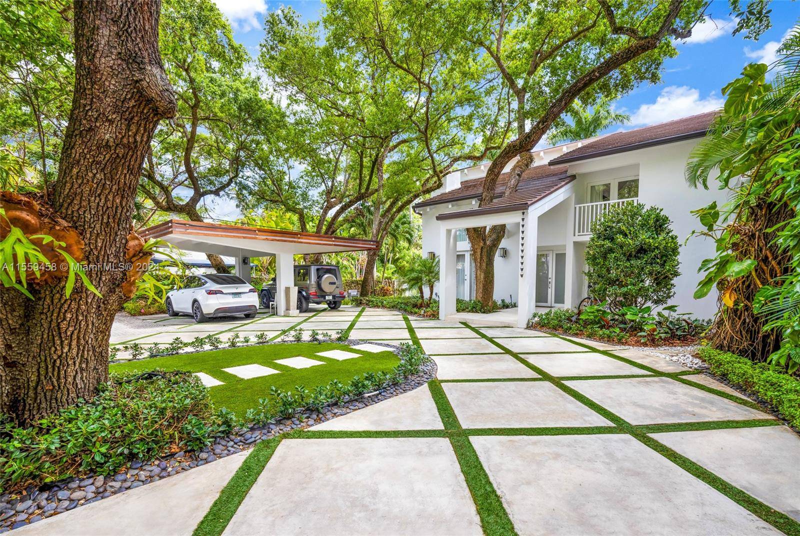 Step into serenity and sophistication in this architectural masterpiece nestled in the heart of Coconut Grove.