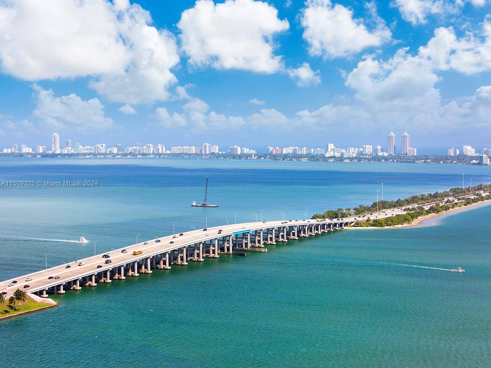 Private elevator foyer and breathtaking panoramic views of Biscayne Bay and Miami Beach.