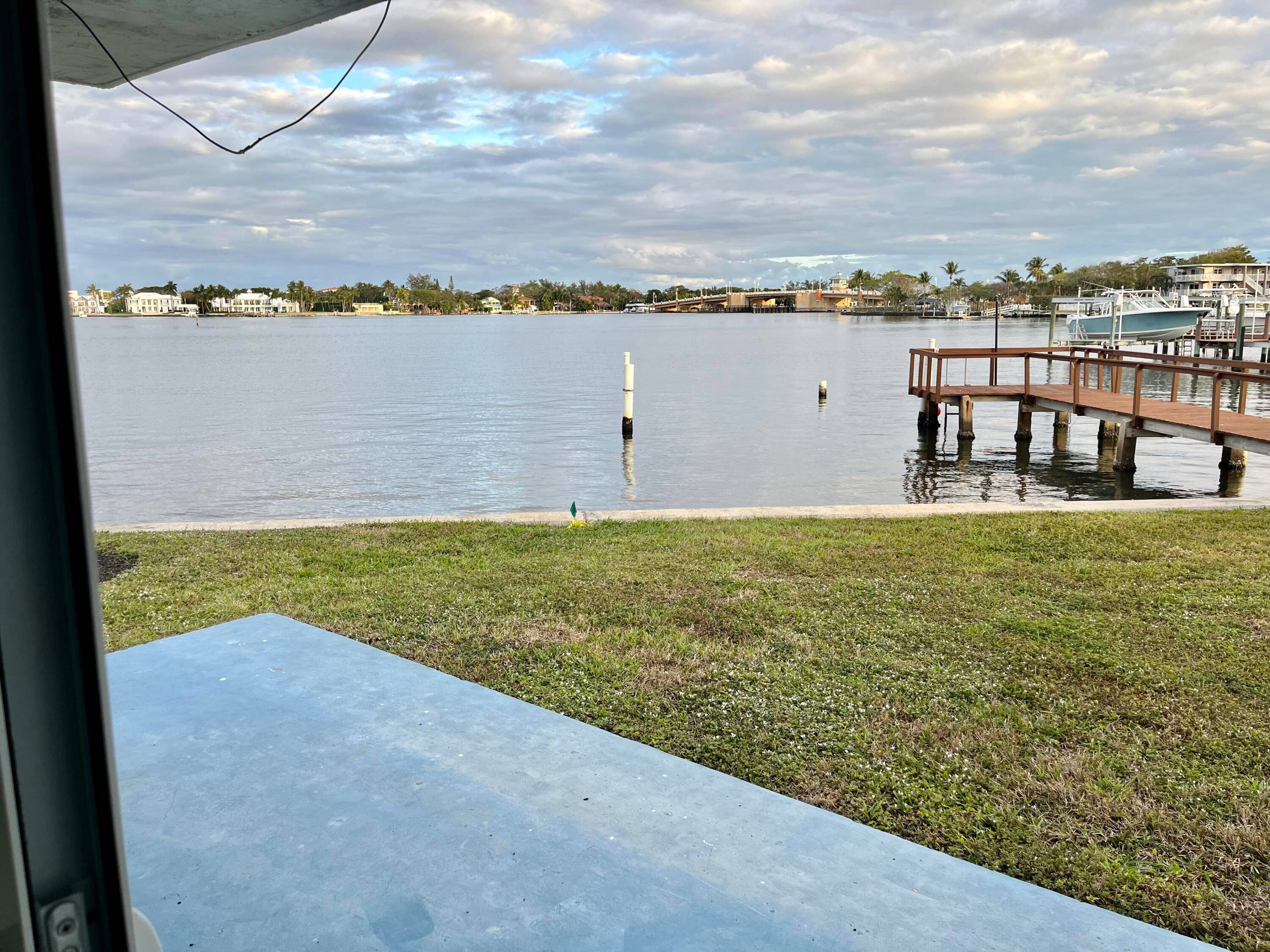 Modern waterfront condo bottom floor unit one of a kind opportunity to live right on the Intracoastal with an amazing view.