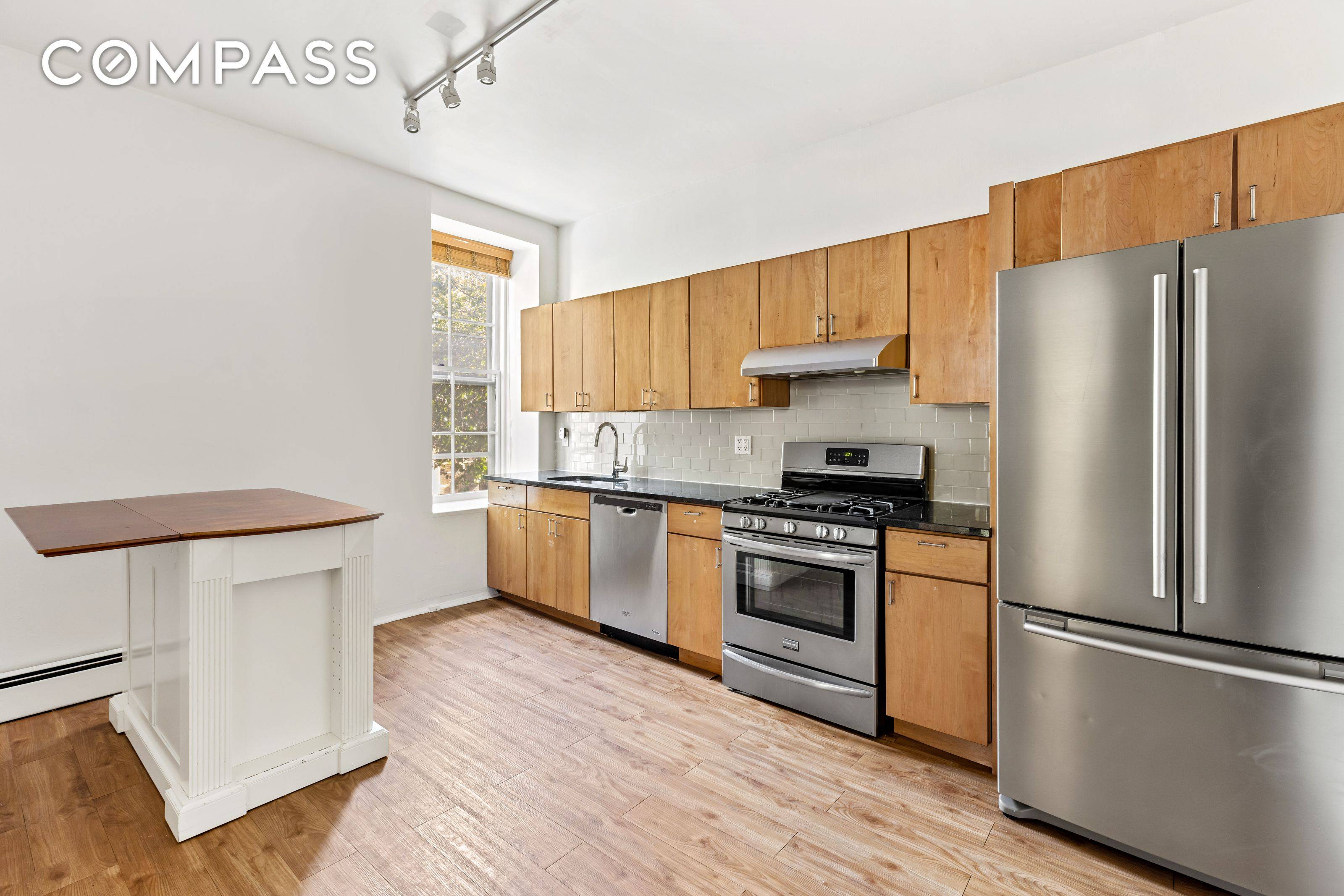 This expansive 2 BR, 2BA duplex is situated in a charming corner, 2 family townhouse on a tree lined block in prime Boerum Hill.