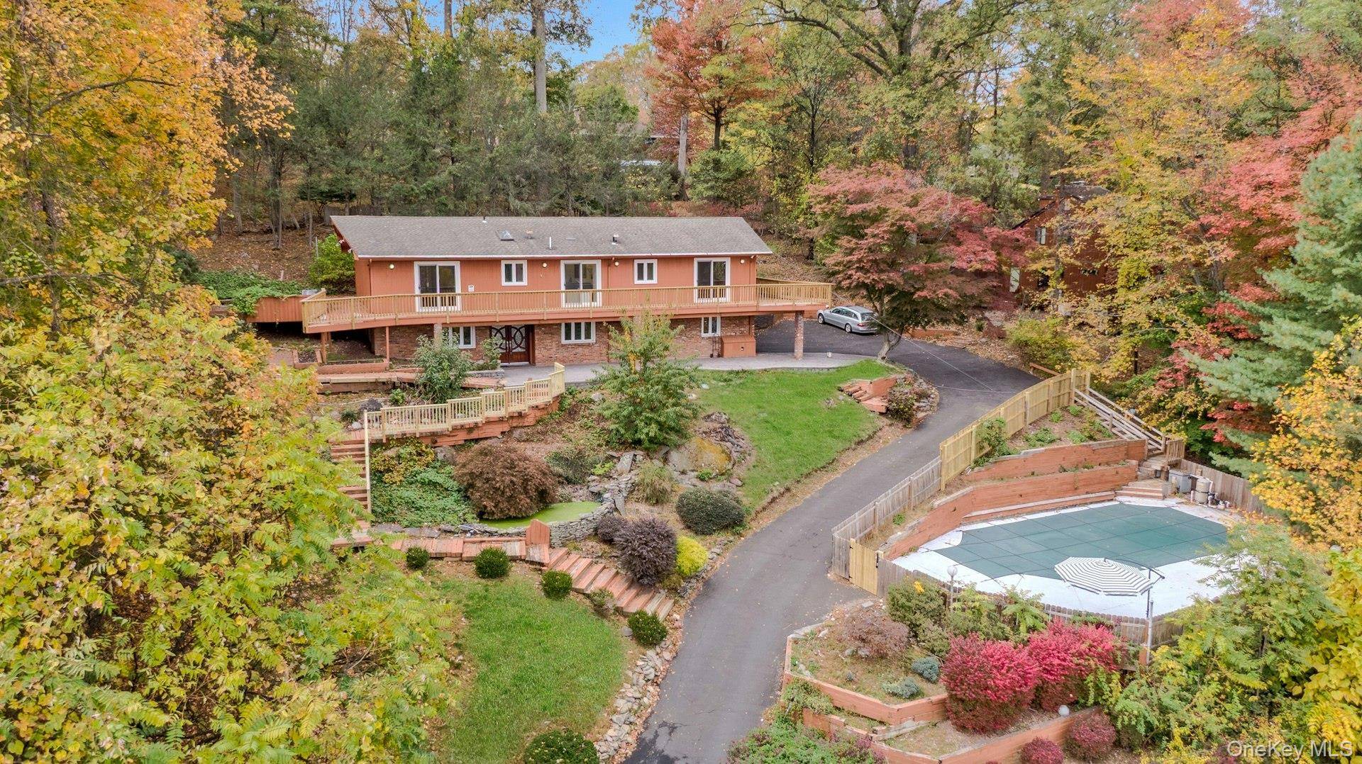 Imagine waking up with a panoramic MOUNTAIN VIEW at this contemporary ranch style home sitting atop of a sloped landscape !