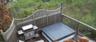 Wooden deck with a covered hot tub