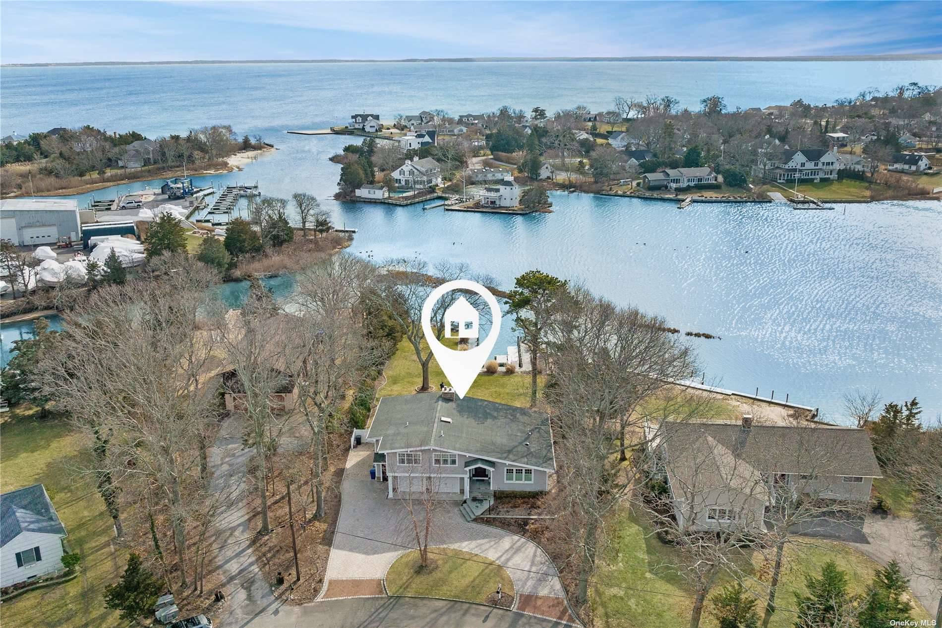 Stunning and turn key waterfront home boasts a deep water dock and so much more !