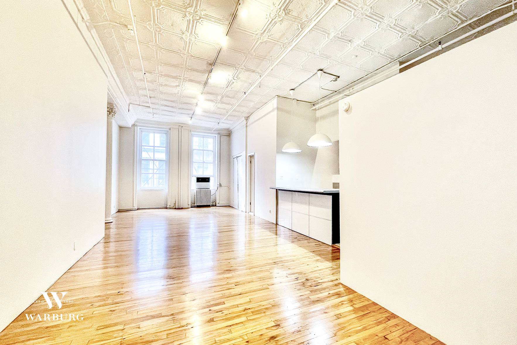 South facing apartment with over sized windows in a Cast Iron Tribeca Rental Building.