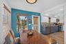Dining space adjacent to the kitchen (front door visible)