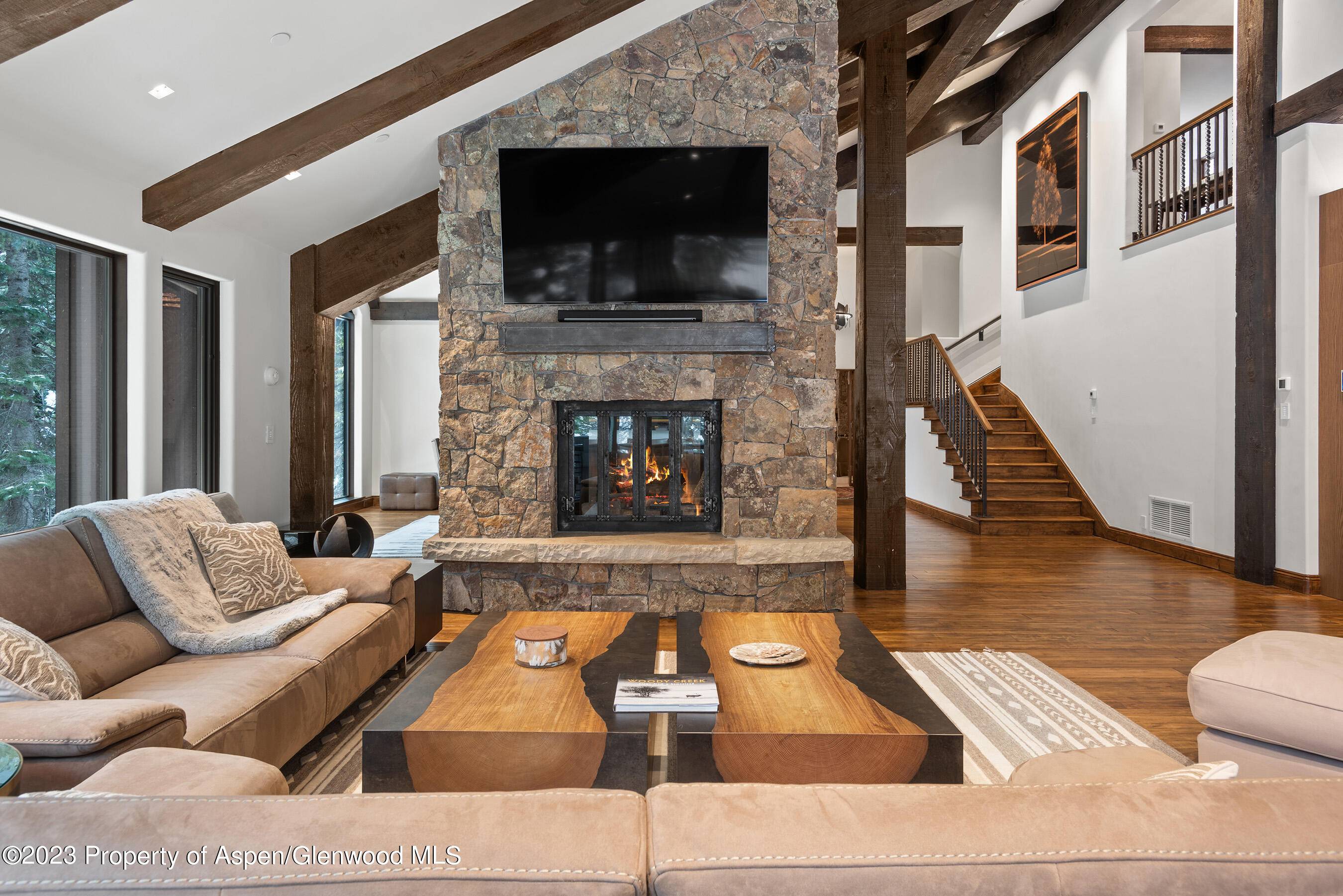 Immerse yourself in the allure of this newly renovated Aspen retreat that seamlessly blends modern elegance with a profound connection to nature.