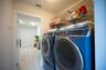 The laundry room is located in the Casita and also features a large storage room. Both rooms are air conditioned. The storage room would also be a g