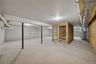 Unfinished below grade area with heating unit