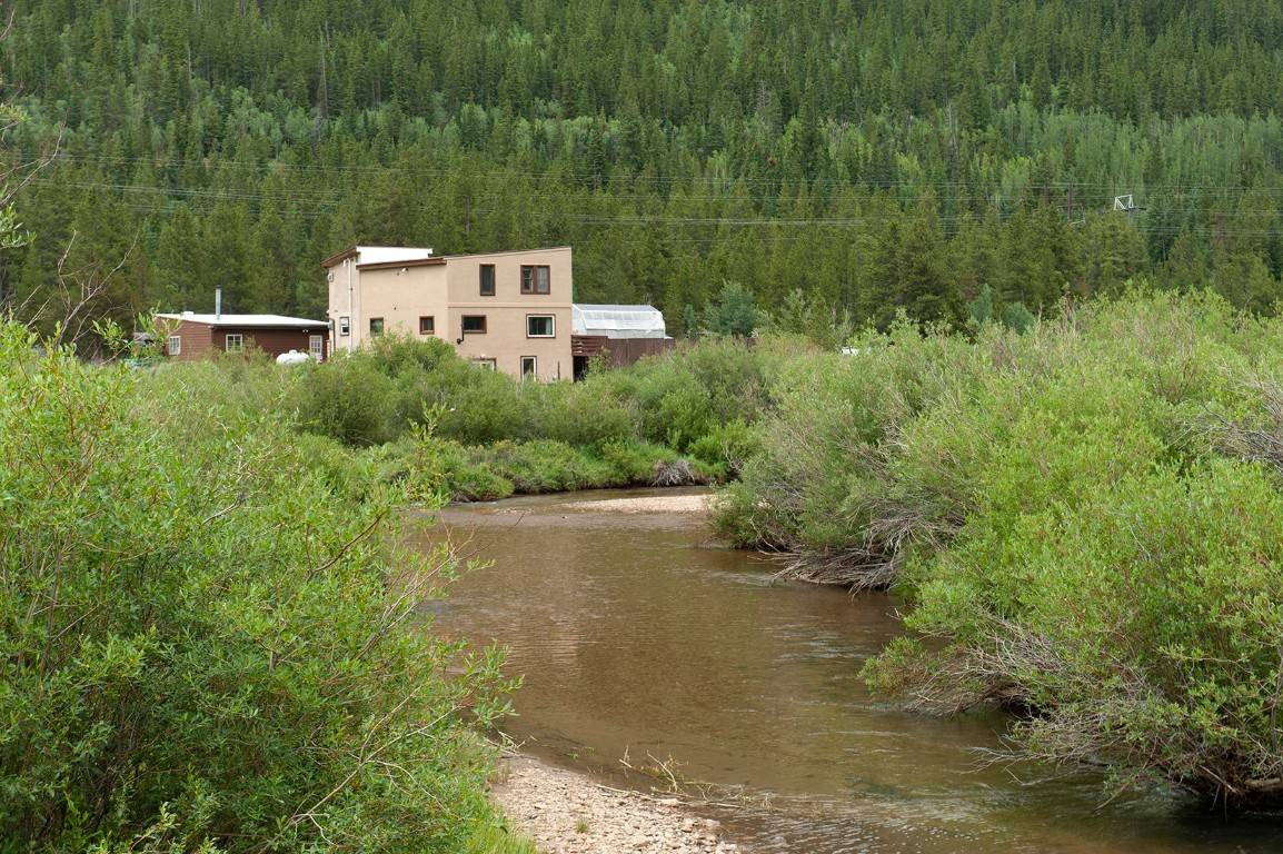 This home offers incredible views and has the East Fork of the Arkansas river flowing through.
