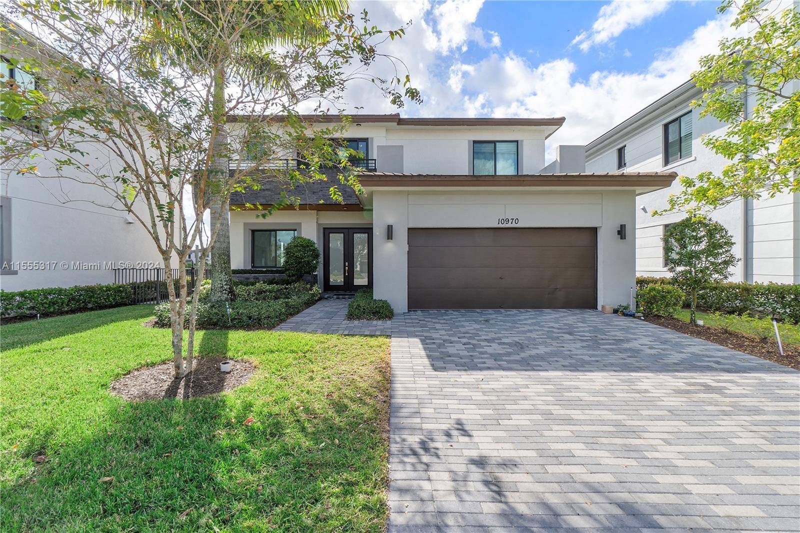 Come take a look at this stunning two story contemporary home in the luxurious guard gated community of Cascata.