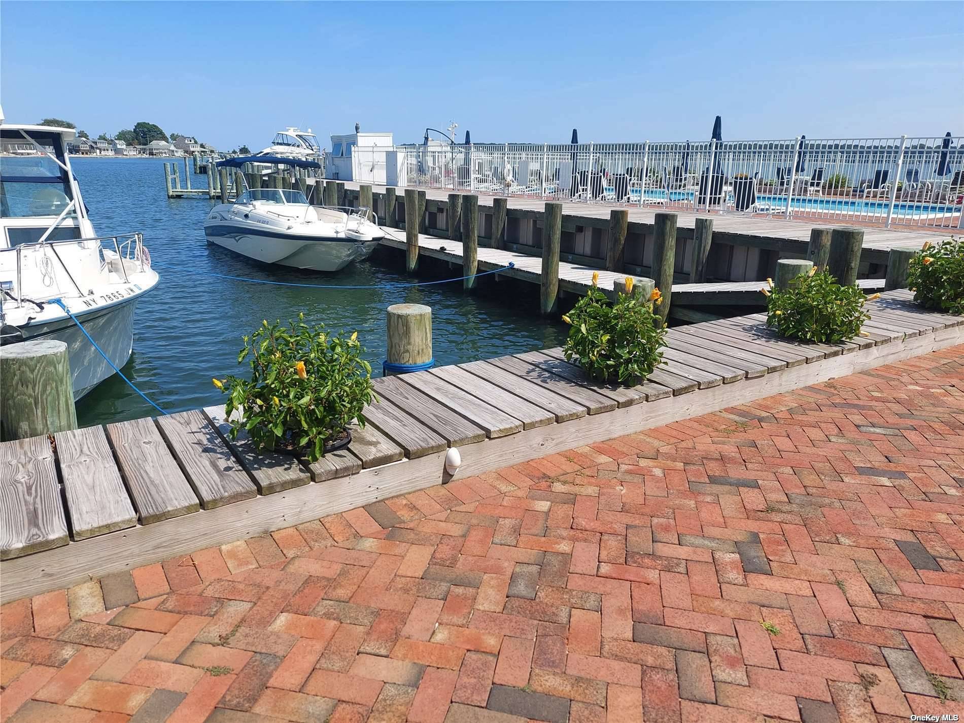 beautiful, Vibrant Greenport Expansive Heated Pool, private parking, Deeded Boat slip INCLUDED.