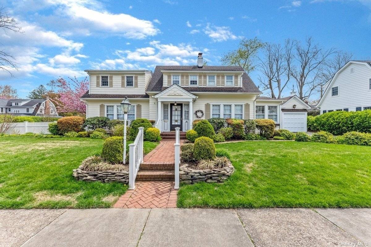 This Quintessential Colonial, with beautiful landscaping amp ; white picket fence, sits on a picturesque, tree lined street and is truly captivating.