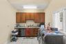 A well-appointed secondary kitchen, complete with a butler's pantry and adjacent laundry room, enhances the estae exceptional entertaining capabilitie