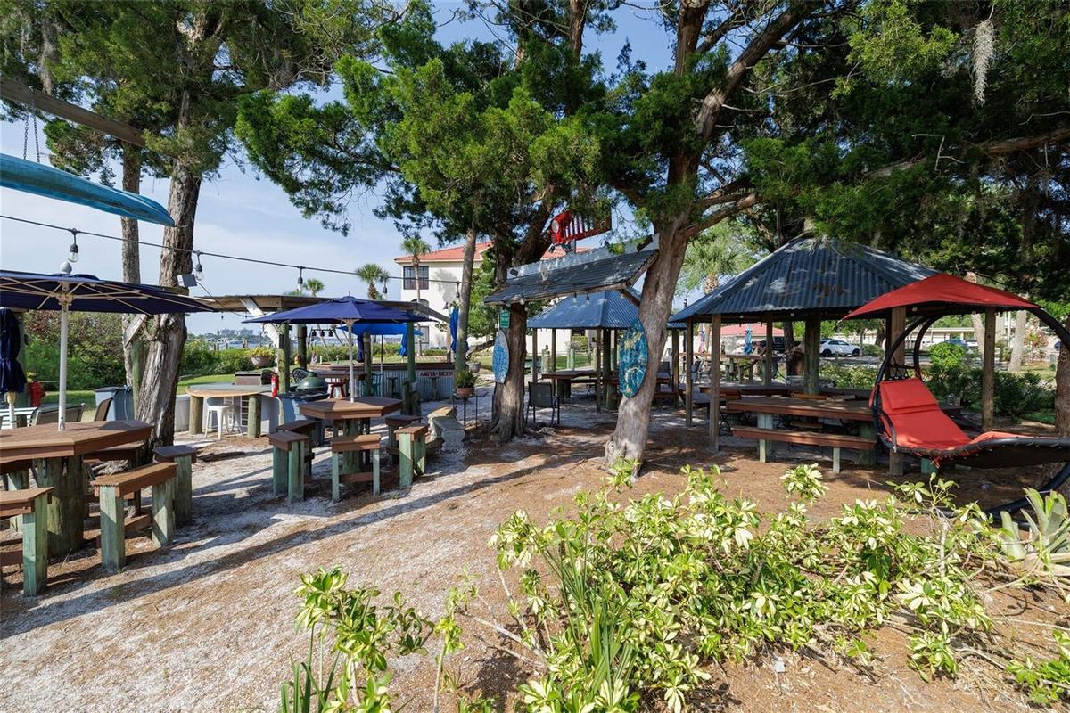 Tiki huts, picnic tables, BBQ grills & firepits to enjoy!