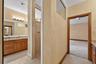 Dual sink vanity with granite counters and wood cabinetry