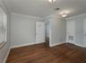 Large room/office/conference room with record room/library.