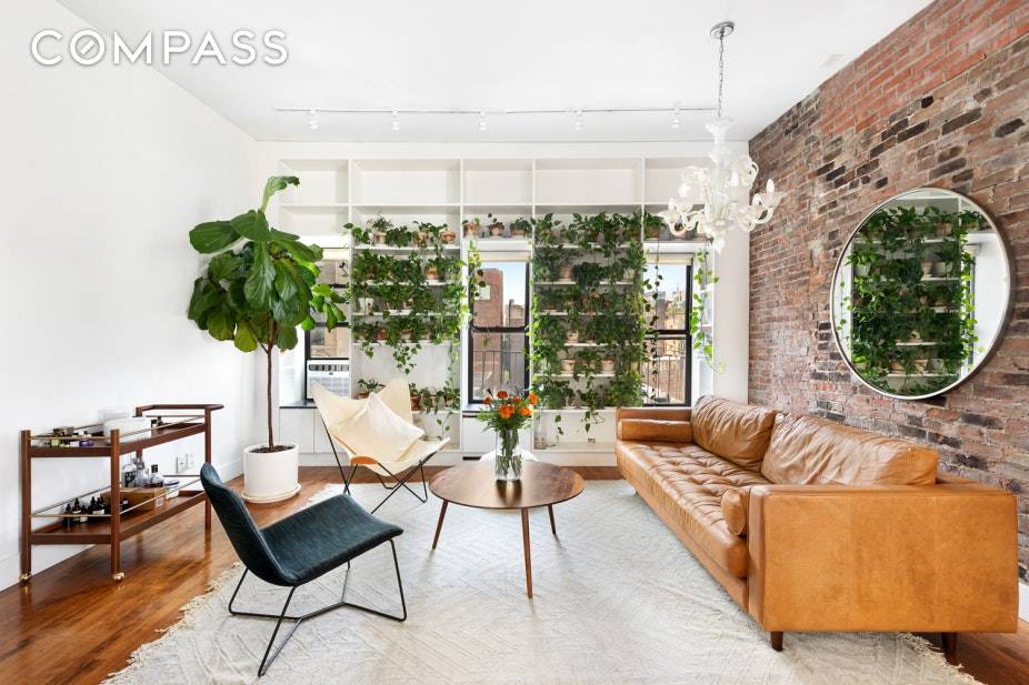 Bathed in glorious light and chic interiors, this spacious floor through, one bedroom convertible 2, one bathroom condominium is the perfect East Village haven.