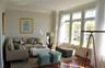 Entry hall with powder room opens up to generous living room... over sized windows make it light & bright...