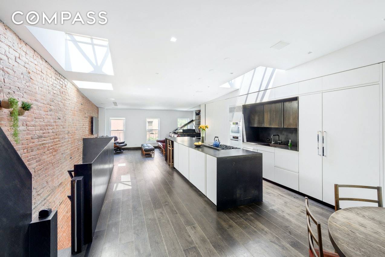 This exquisite and renovated East Village top floor two bedroom convertible to three, two and a half bathroom home features townhouse garden views, a private south facing roof terrace and ...