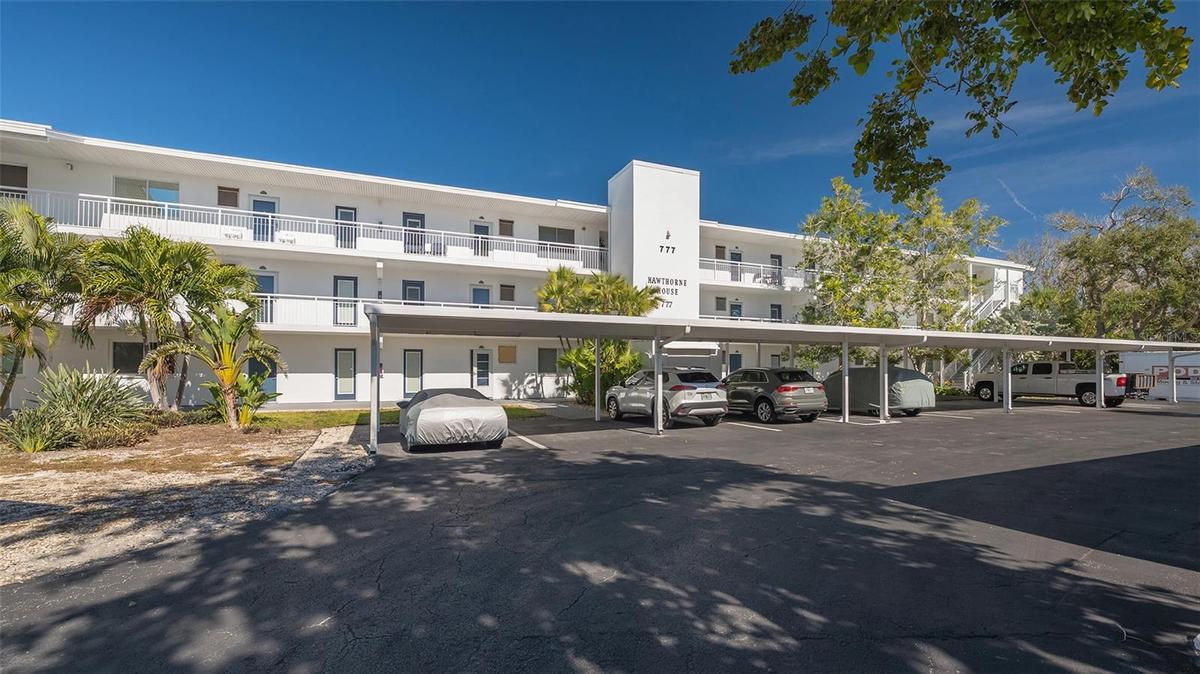 The front entry offers covered parking for each unit, and a generous amount of guest parking for a second vehicle