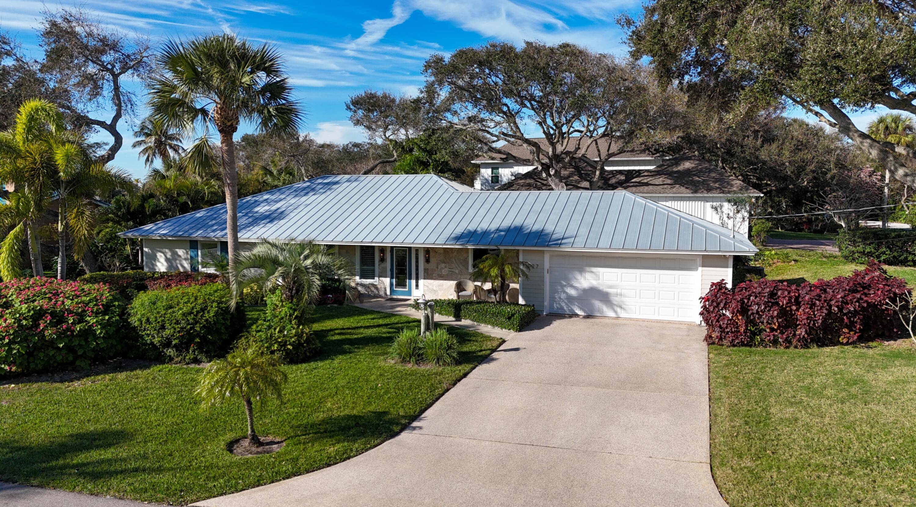 A true Beach River retreat, this natural light filled three bedroom, three bathroom residence offers 2, 080 square feet of coastal living space, poised on a manicured.