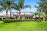 Lush, Landscaped Backyard with a Private Screened Pool