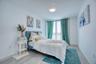 Bedroom featuring baseboards and wood finished floors