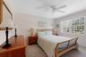 Bedroom featuring carpet and ceiling fan