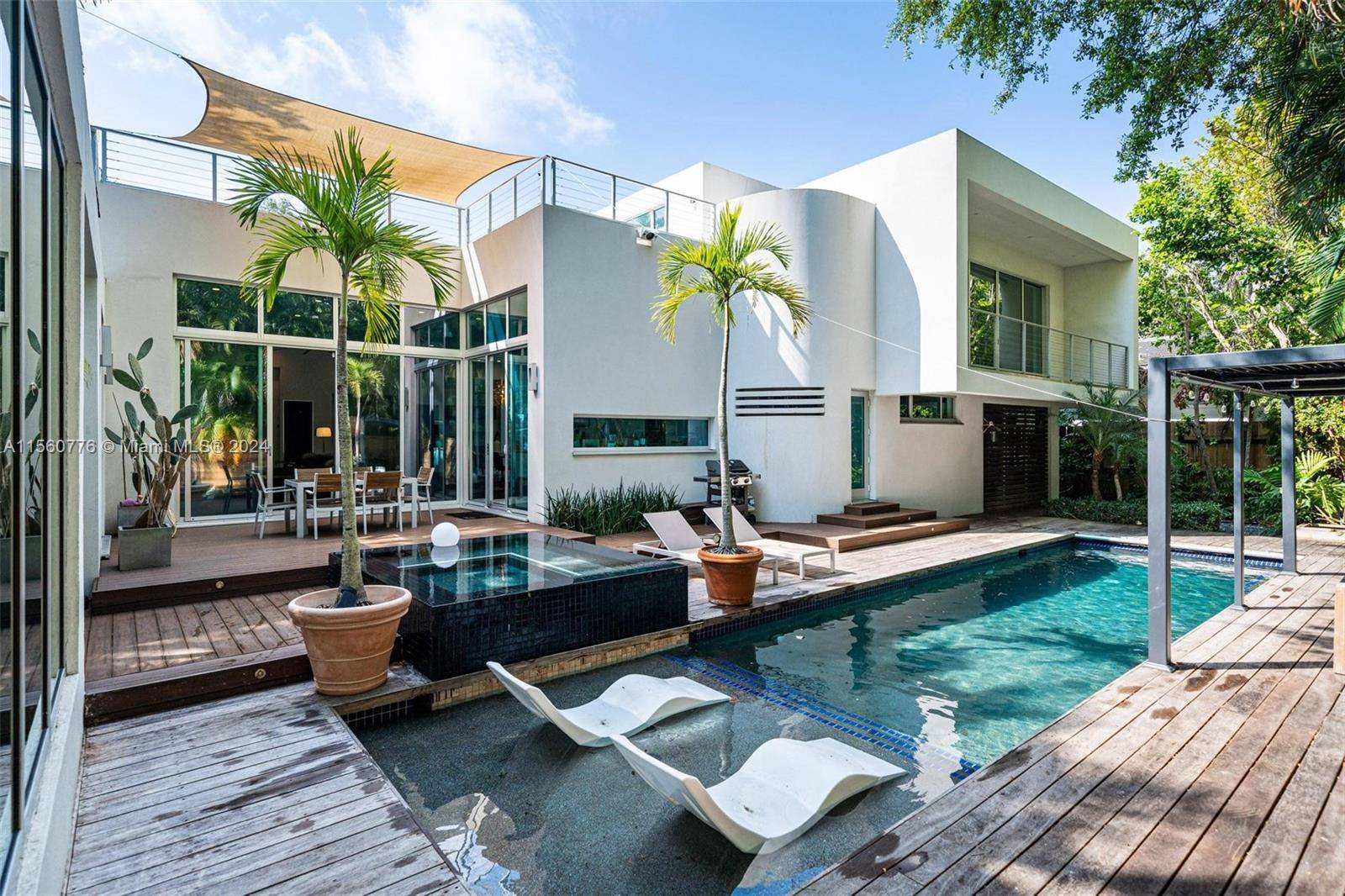 Discover this ultra chic, gated contemporary gem in the sought after Grove area.