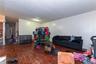 Living room with wood finished floors and a textured ceiling