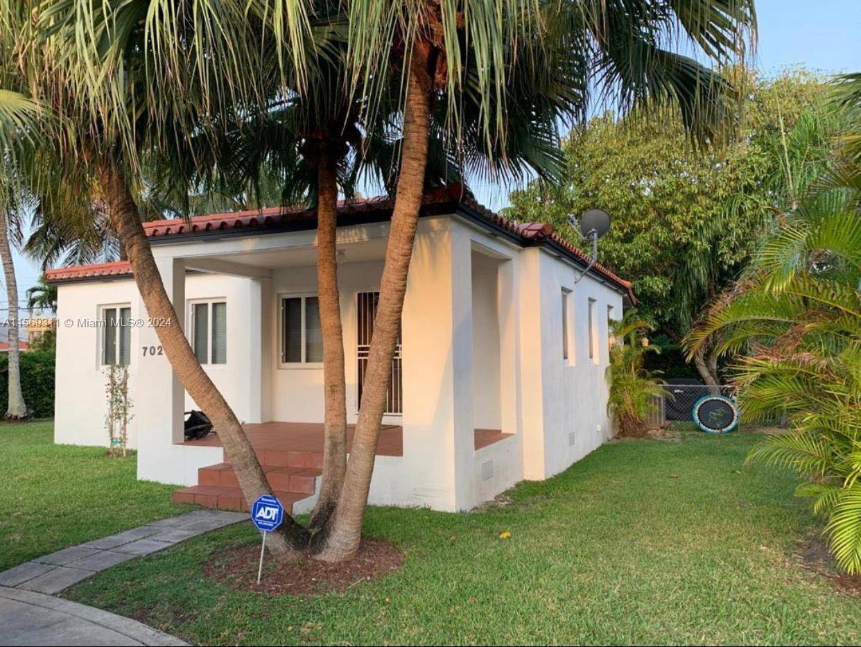 3 1 Coral Gables home with a Nice kitchen, updated bathroom, Impact windows, Wood Floors throughout, beautiful yard.