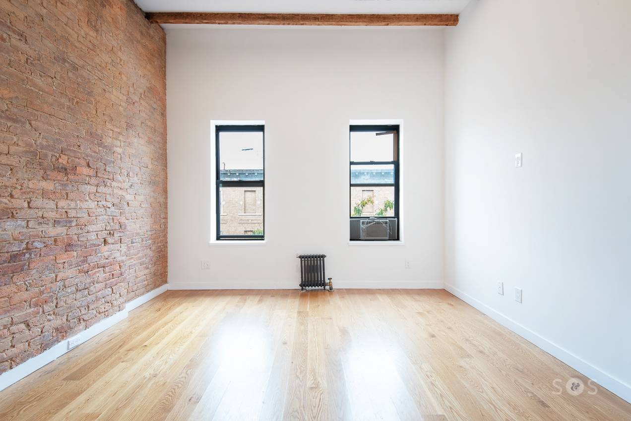 This renovated loft like two bedroom apartment features condo like finishes.