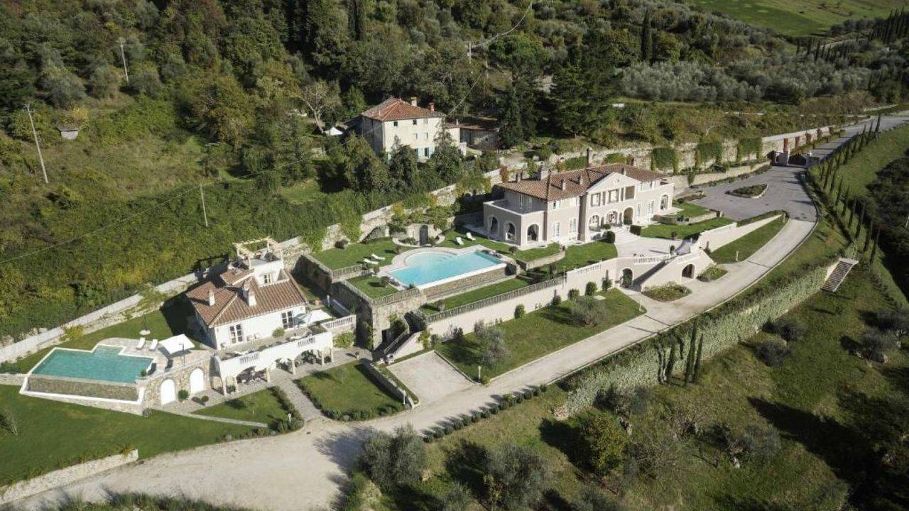 Property with two renovated villas, two infinity pools with solarium and garden for sale a few kilometres from the city of Florence, Tuscany.