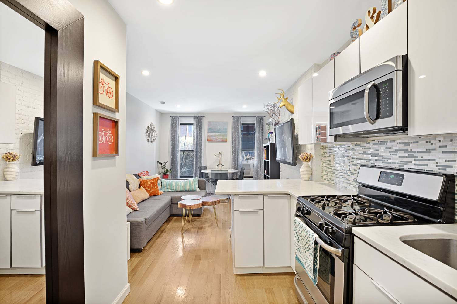 This sleek and modern one bedroom floor through home in Kips Bay has a newly renovated kitchen with beautiful carrara marble countertops, white lacquer cabinets, a breakfast bar, a full ...