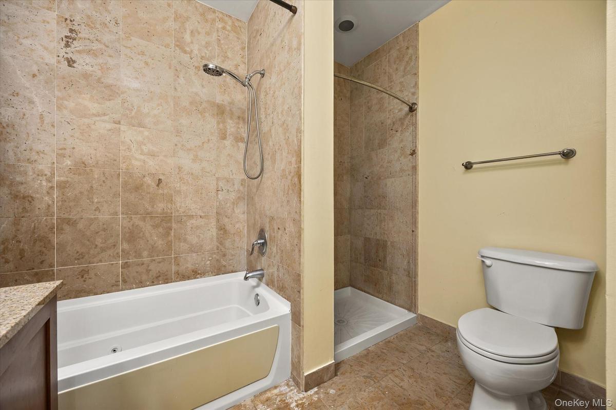 # Primary Bathroom with tub and stand up shower