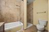 # Primary Bathroom with tub and stand up shower