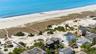 Aerial view with a water view and a view of the beach