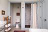 Bathroom featuring toilet and a shower stall