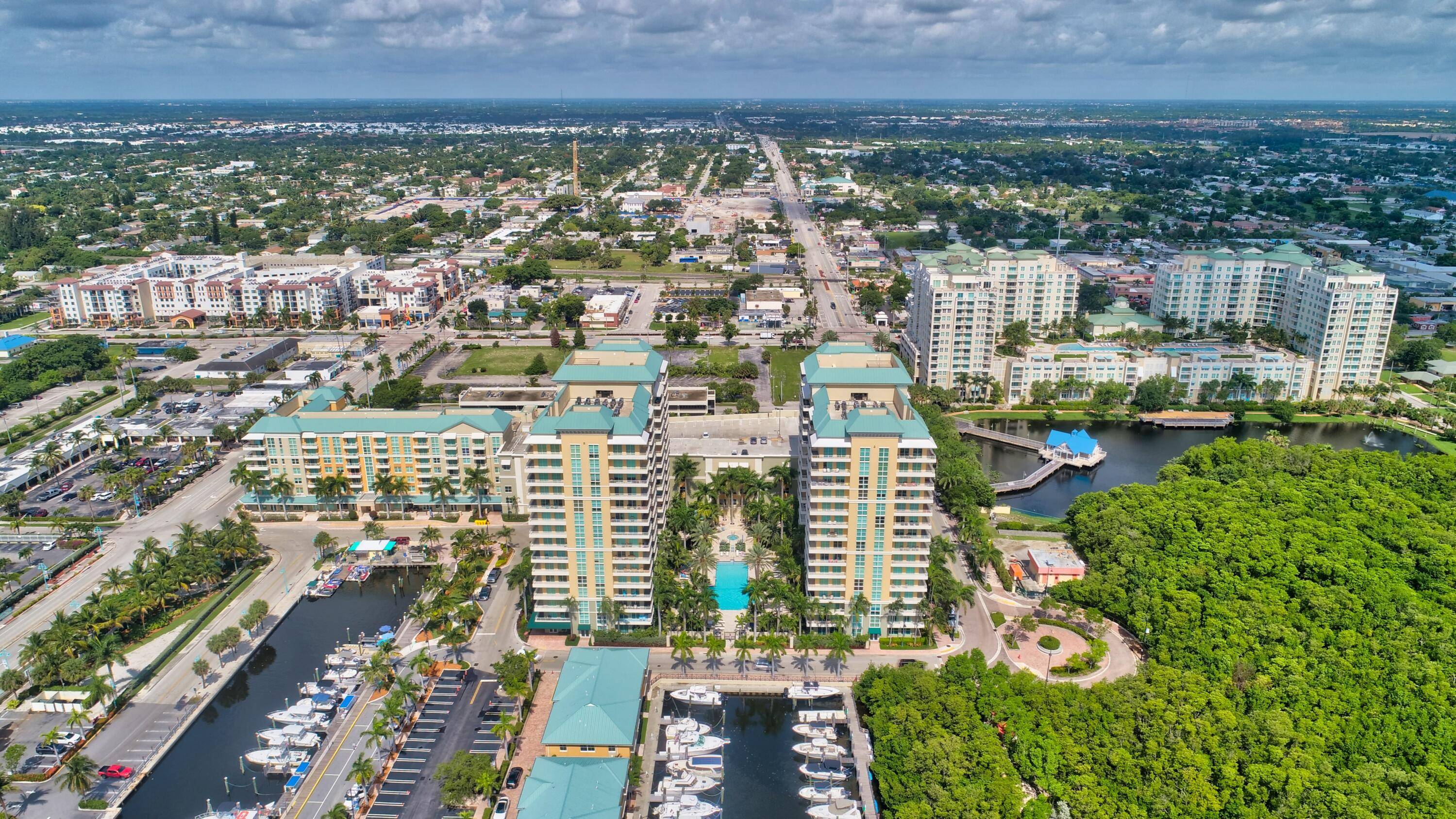 Step into your personal oasis with this remarkable 2 bedroom, 2 bathroom condo featuring an expansive wraparound balcony offering unparalleled views of the serene marina and glistening water.