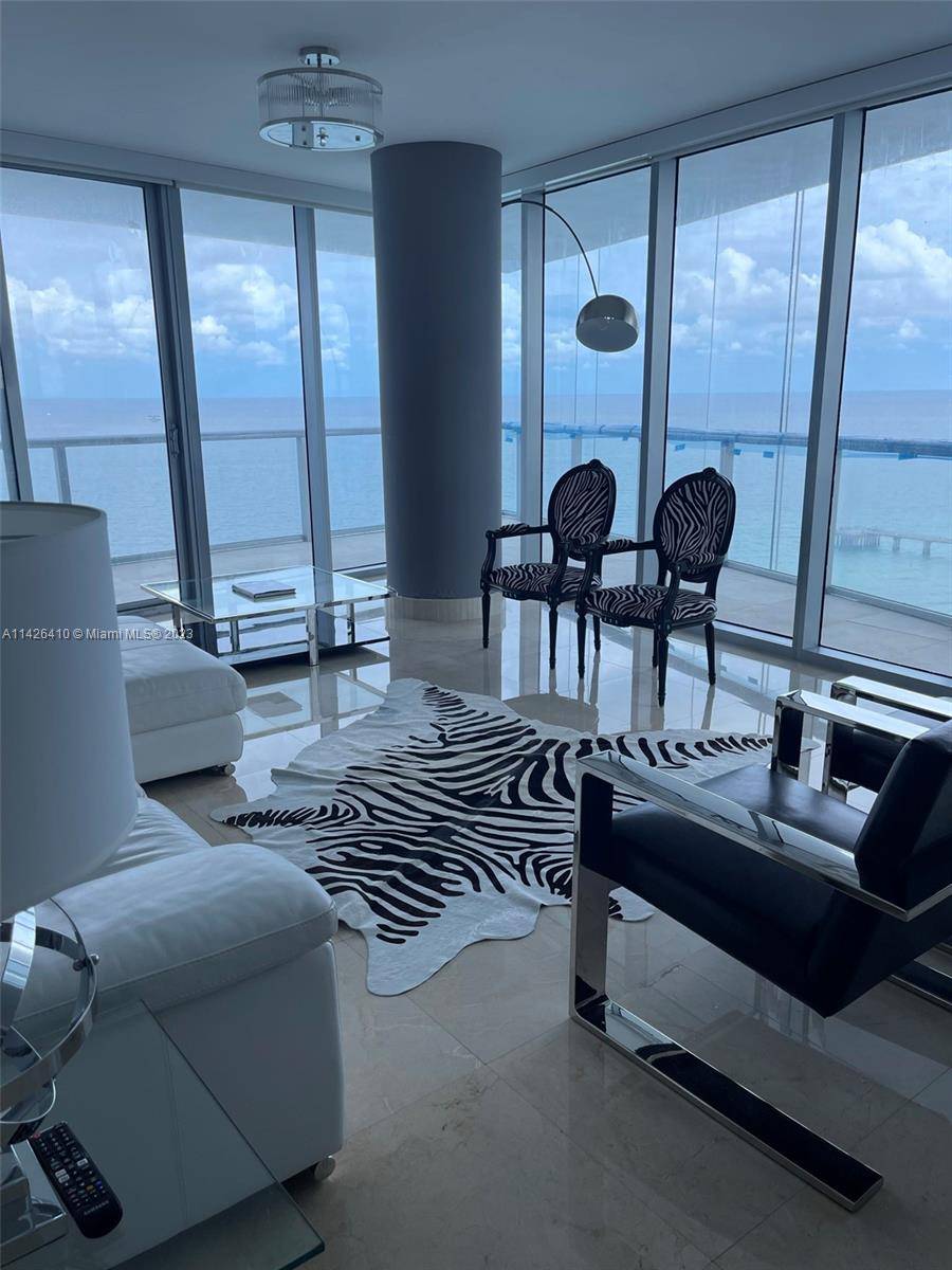 STUNNING OCEANFRONT CORNER UNIT 4 BEDS 4 BATHS UNIT WITH OCEAN, CITY AND INTRACOASTAL VIEWS FROM THE OVERSIZED WRAPAROUND BALCONY.