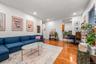 Living room with light wood-style floors and recessed lighting