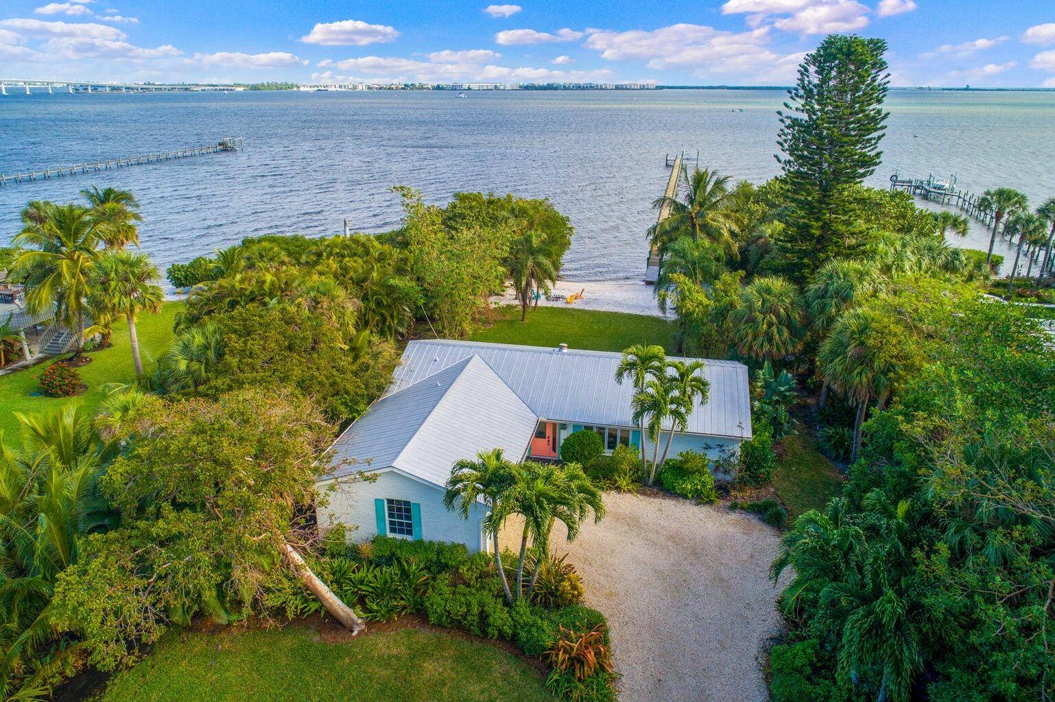Charming and private beach cottage with a brand new infinty pool and it's own dock for boaters and fisherman.